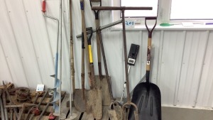 Assorted shovels and post hole augerâ€™s